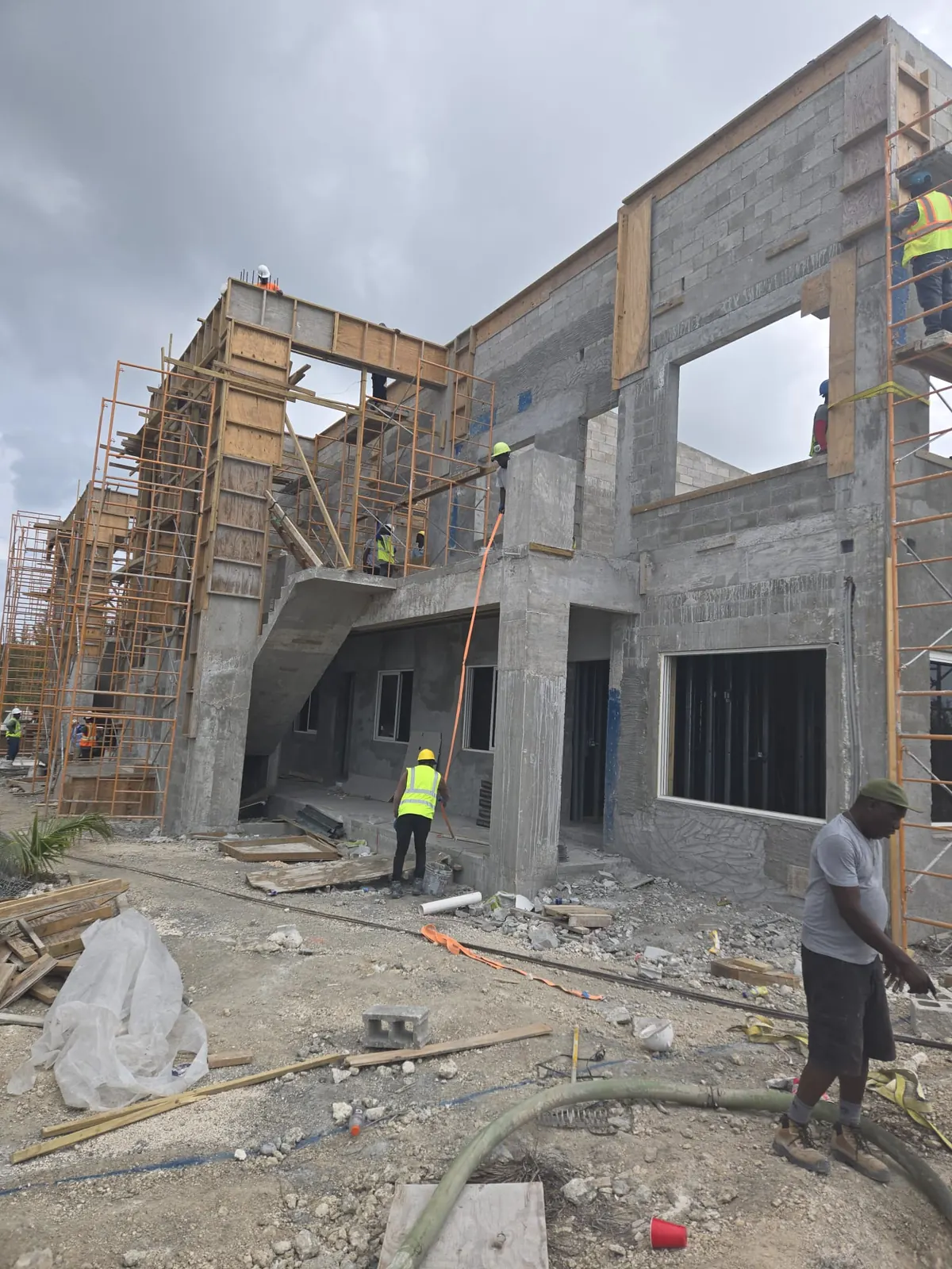 Crew working on a two-storey masonry building