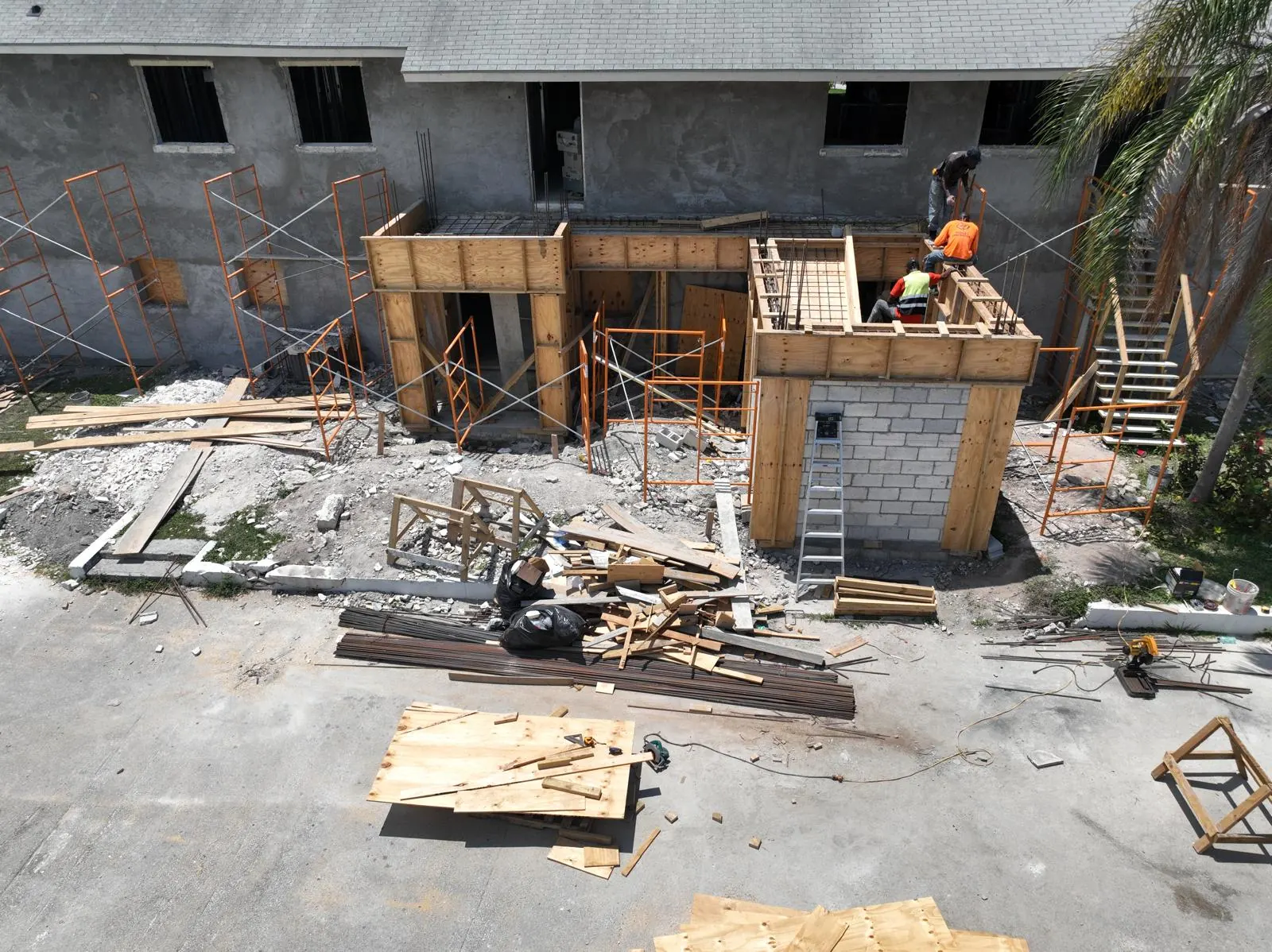 Humble Hands crew building concrete formwork on a commercial renovation