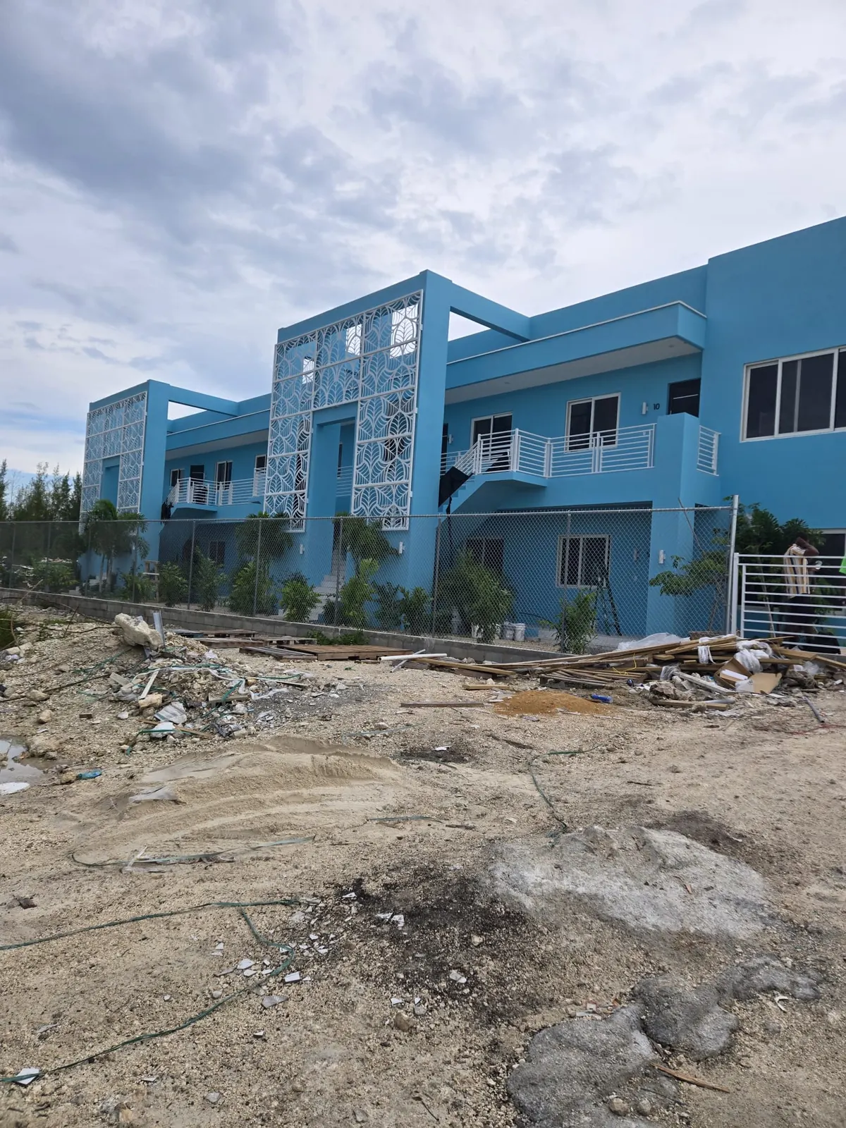 Completed two-storey multi-unit building with decorative screens
